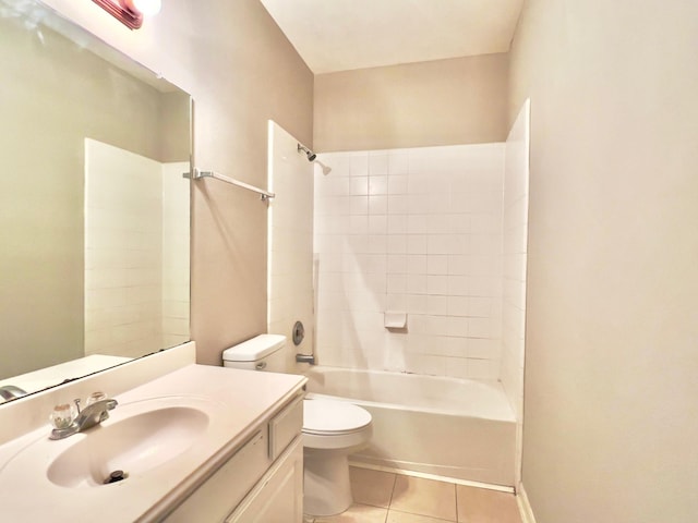 full bathroom with tile patterned floors, toilet, tiled shower / bath combo, and vanity