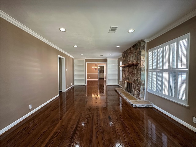 unfurnished living room with a stone fireplace, visible vents, baseboards, ornamental molding, and dark wood finished floors