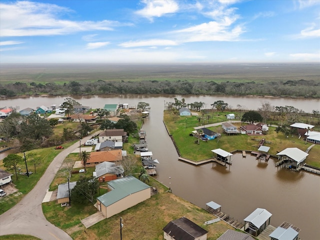 bird's eye view with a water view and a residential view