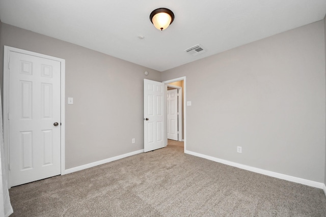 unfurnished bedroom with carpet floors