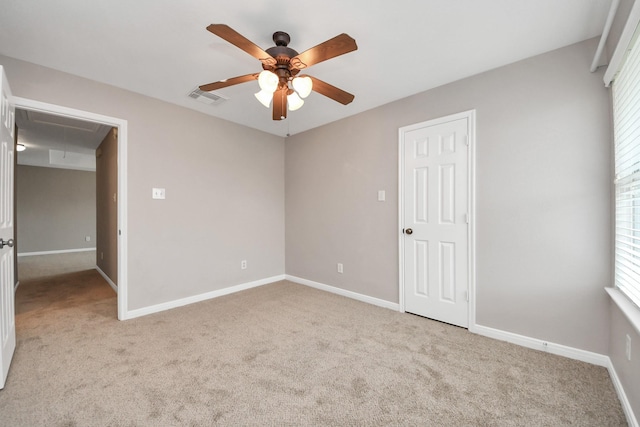 unfurnished bedroom featuring light colored carpet and ceiling fan