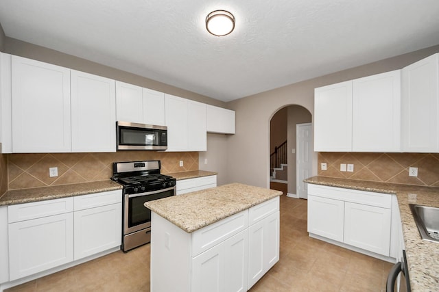 kitchen featuring appliances with stainless steel finishes and white cabinets