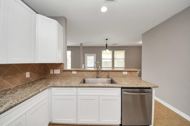 kitchen with white cabinetry, sink, and stainless steel dishwasher