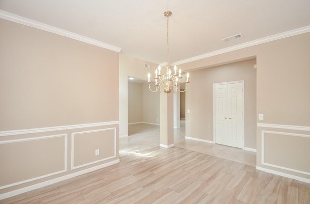 unfurnished dining area with a notable chandelier, ornamental molding, and light wood-type flooring