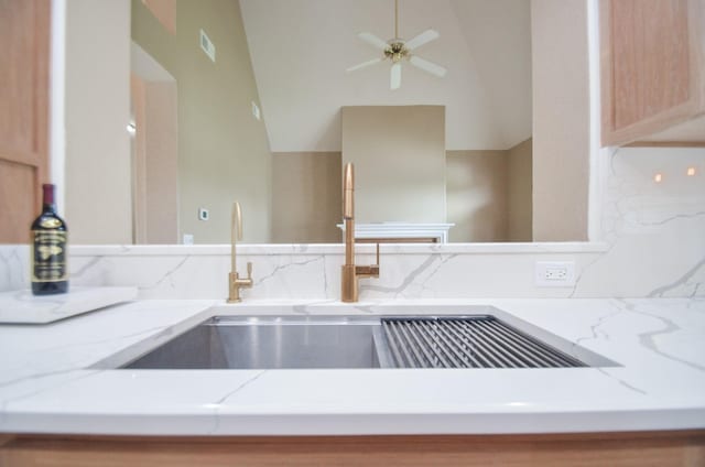 room details featuring sink, light brown cabinetry, and ceiling fan