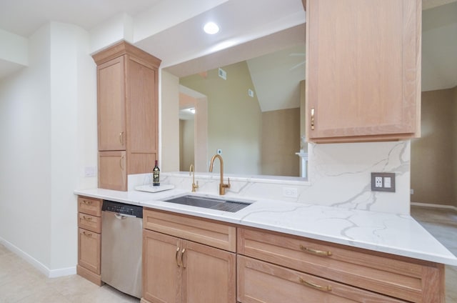 kitchen featuring sink, light brown cabinets, stainless steel dishwasher, light stone countertops, and decorative backsplash