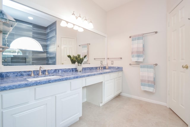 bathroom with vanity, tile patterned flooring, and a shower