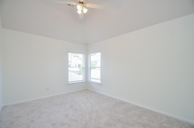 empty room featuring light carpet and ceiling fan