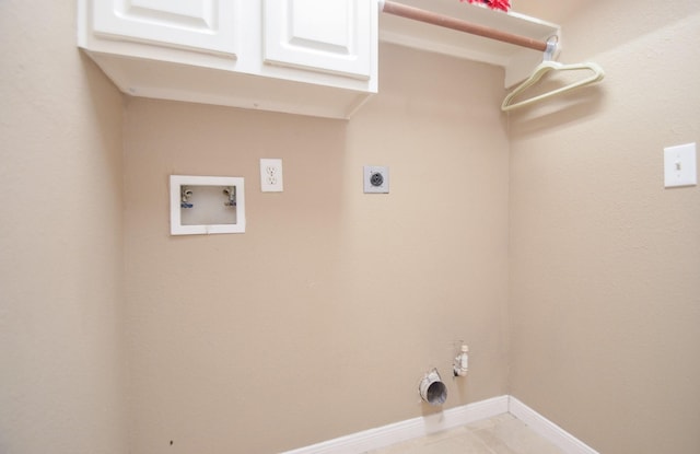 laundry room with cabinets, hookup for an electric dryer, hookup for a washing machine, and light tile patterned floors