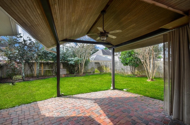 view of patio featuring ceiling fan