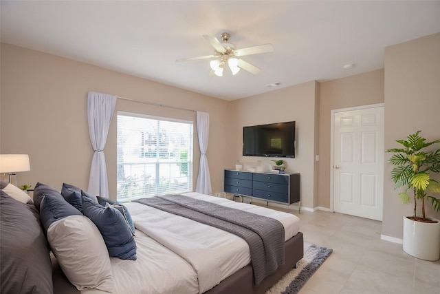 bedroom with light tile patterned floors and ceiling fan