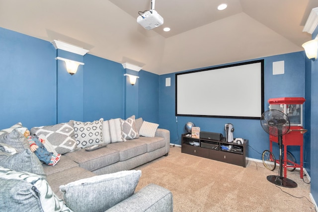 home theater with lofted ceiling and carpet flooring