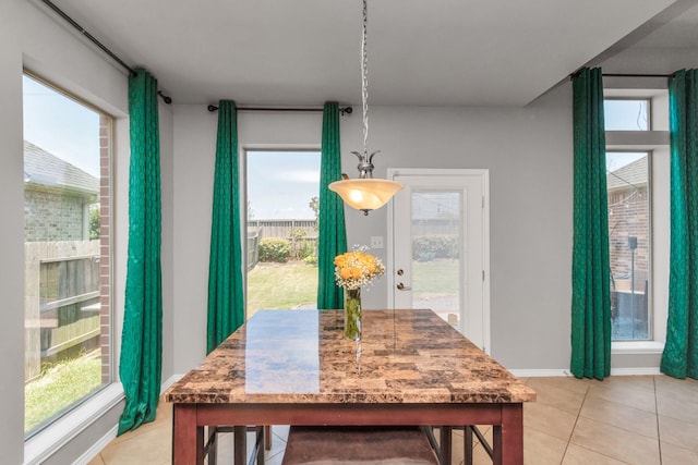 dining space with light tile patterned flooring