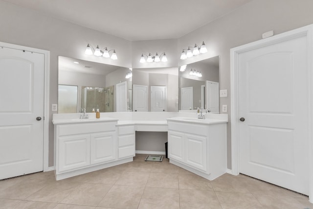 bathroom featuring vanity, tile patterned floors, and walk in shower