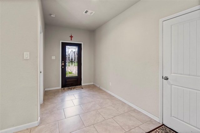 entrance foyer with light tile patterned floors