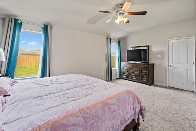 carpeted bedroom featuring vaulted ceiling and ceiling fan