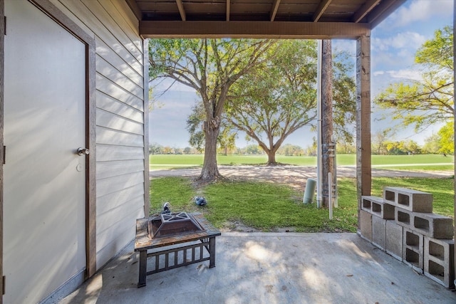 view of patio with an outdoor fire pit