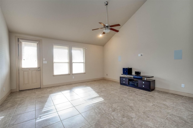 unfurnished living room with ceiling fan, high vaulted ceiling, and light tile patterned floors