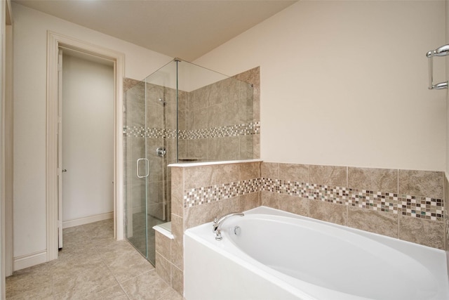 bathroom featuring tile patterned flooring and plus walk in shower