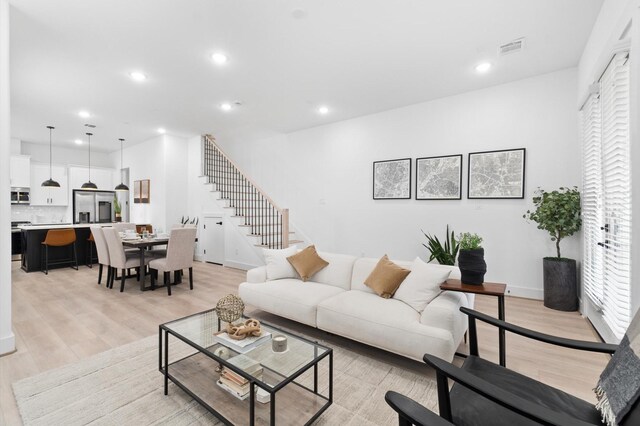 501 E 39th St, Houston, TX 77022 - living room with stairs, light wood-type flooring, healthy amount of natural light, and recessed lighting