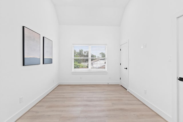 501 E 39th St, Houston, TX 77022 - empty room with light wood-style flooring and lofted ceiling