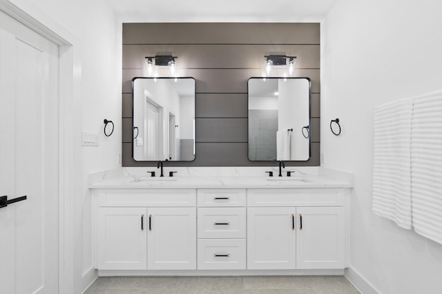 501 E 39th St, Houston, TX 77022 - full bath with double vanity and baseboards