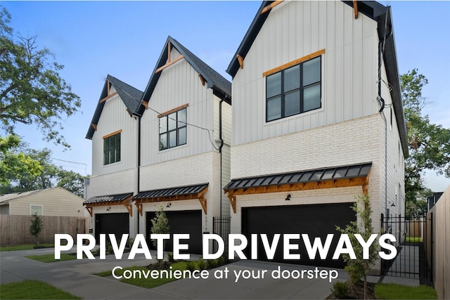 501 E 39th St, Houston, TX 77022 - view of front facade featuring an attached garage, brick siding, a standing seam roof, and driveway