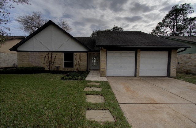 view of front of property featuring concrete driveway, a shingled roof, an attached garage, a front yard, and brick siding