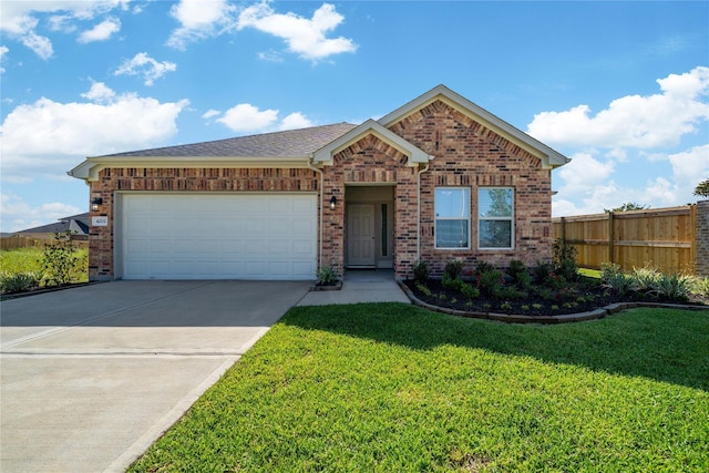 view of front of home with a garage and a front lawn