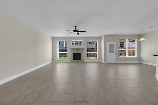 unfurnished living room with light hardwood / wood-style floors and ceiling fan