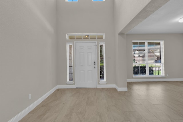 foyer entrance featuring a high ceiling