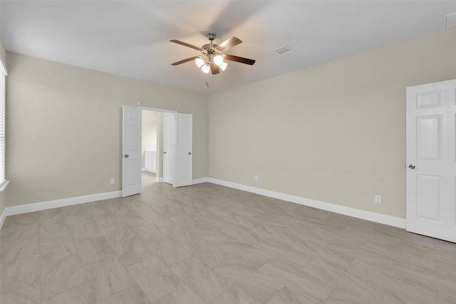 empty room featuring ceiling fan