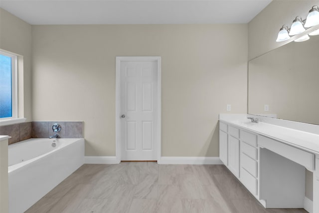 bathroom with a bath and vanity