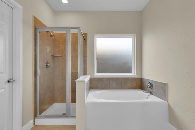 bathroom featuring plus walk in shower