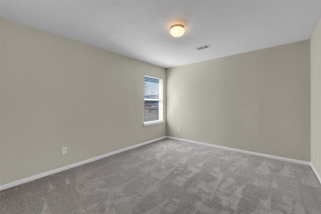 empty room with light colored carpet