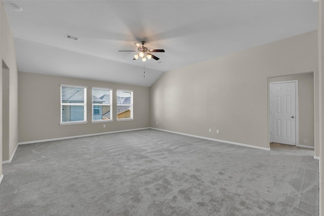 unfurnished room with ceiling fan, light carpet, and lofted ceiling