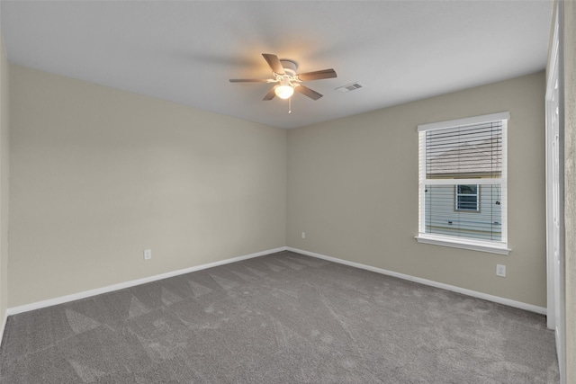 spare room with ceiling fan and carpet flooring