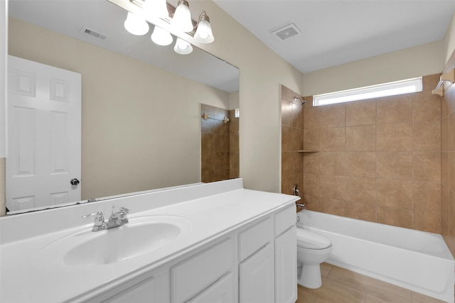 full bathroom featuring tiled shower / bath combo, vanity, and toilet