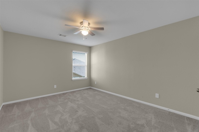 empty room with light carpet and ceiling fan