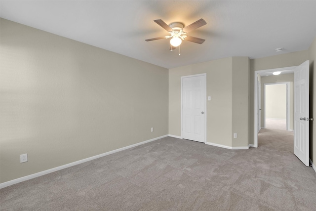 unfurnished bedroom with light carpet and ceiling fan