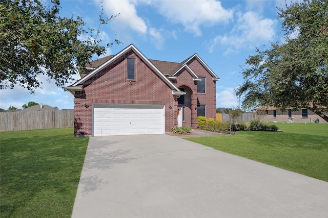 view of property with a garage and a front lawn