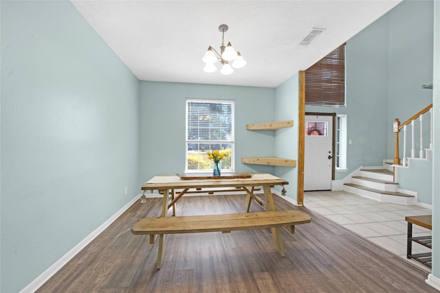 dining space featuring a chandelier and light hardwood / wood-style flooring