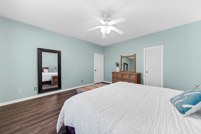 bedroom with ceiling fan and dark hardwood / wood-style floors