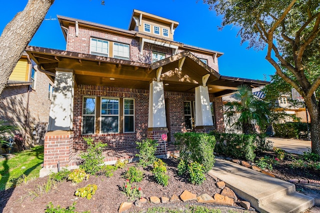 craftsman house with brick siding