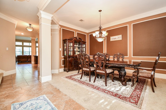 dining space featuring tile patterned floors, visible vents, a notable chandelier, ornamental molding, and decorative columns