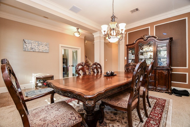 dining area featuring visible vents, carpet floors, ornamental molding, french doors, and a notable chandelier