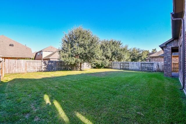 view of yard featuring a fenced backyard