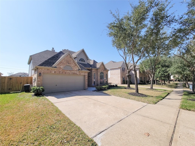 ranch-style home featuring a garage, central AC, and a front yard