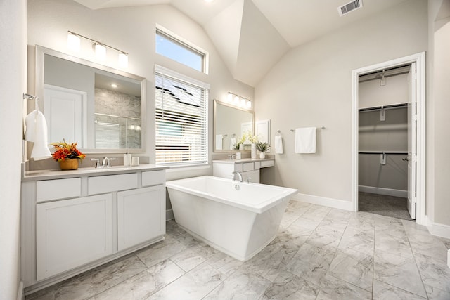 bathroom with marble finish floor, a stall shower, visible vents, and a healthy amount of sunlight