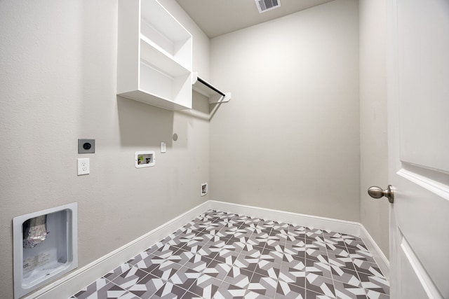 laundry area featuring laundry area, gas dryer hookup, tile patterned floors, hookup for an electric dryer, and washer hookup